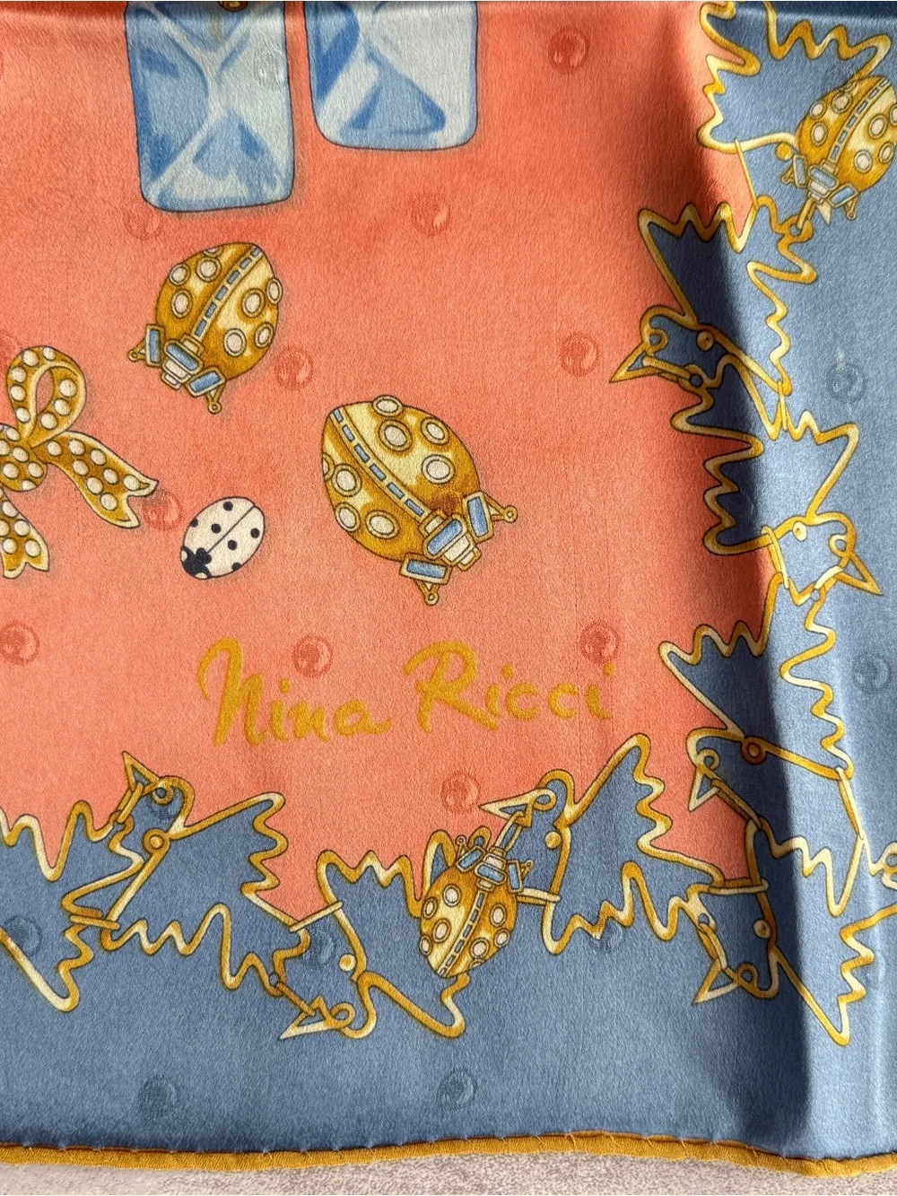 Nina Ricci Coral Scarf with Blue and Gold Jewelry Motifs